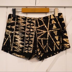 Sequinned gold and black shorts.
